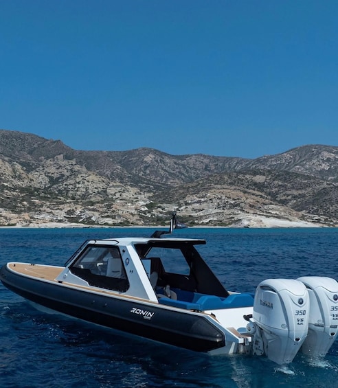 A speedboat named 'RONIN' with two Yamaha outboard motors on a calm sea. 2