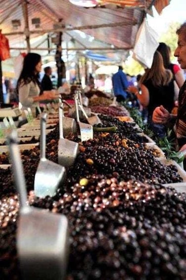 A market stall with heaps of olives. 1