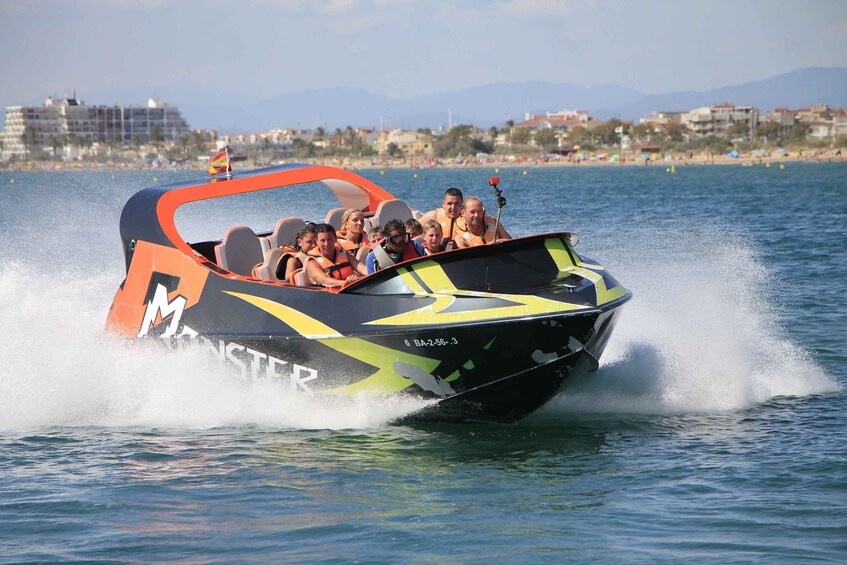 A speedboat with passengers, creating a wake in the water, with a coastal cityscape in the background. 2