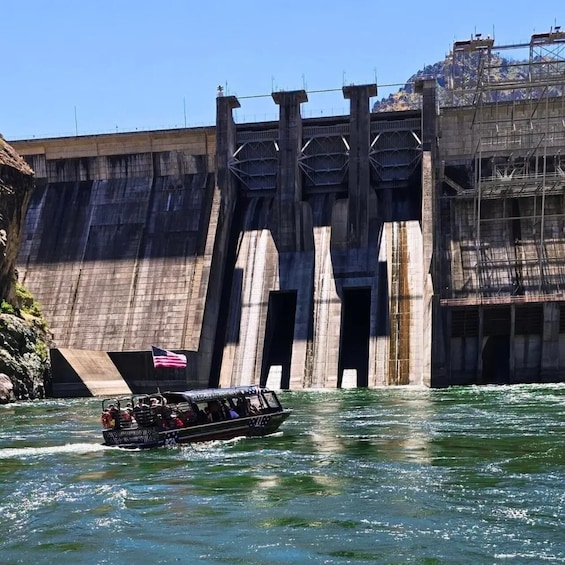 A dam with a boat passing through its gates. 2