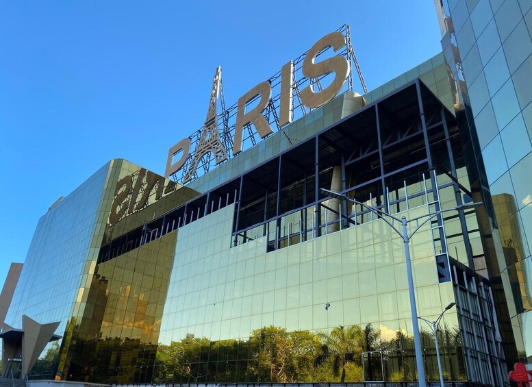 A modern building with a large 'PARIS' sign on top. 4