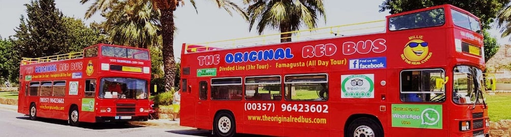 Two red double-decker buses with advertisements for 'The Original Red Bus' and 'Millie.' 2