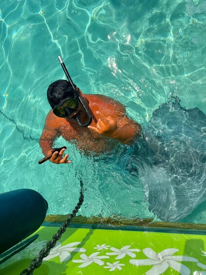 A person snorkeling in a pool with clear water. 2