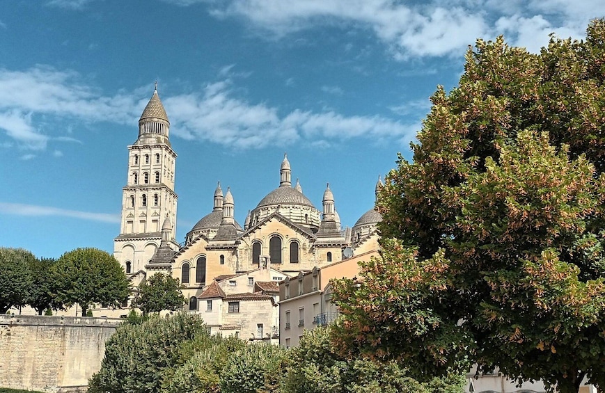 A historic church with multiple domes and a bell tower. 1