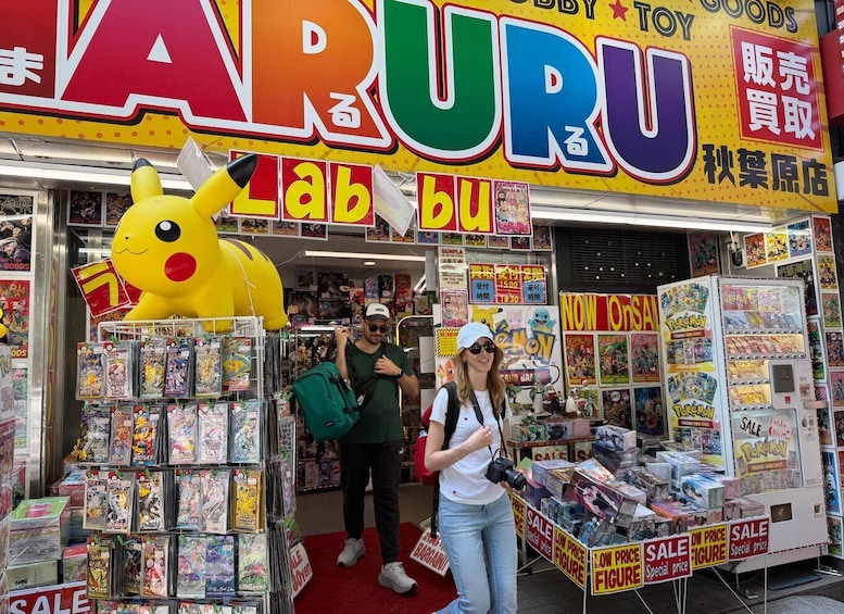 A toy store with a large Pikachu figure, various toys, and signs advertising sales. 4