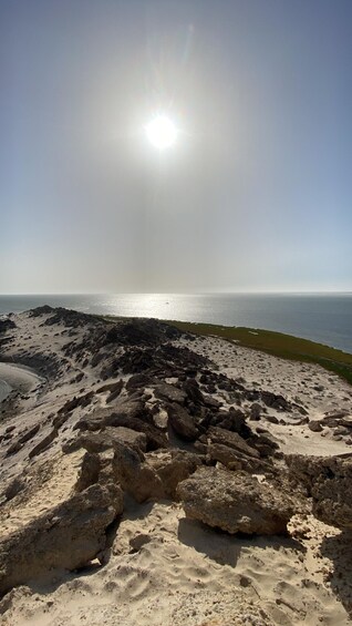 A rocky beach with the ocean in the background. 3