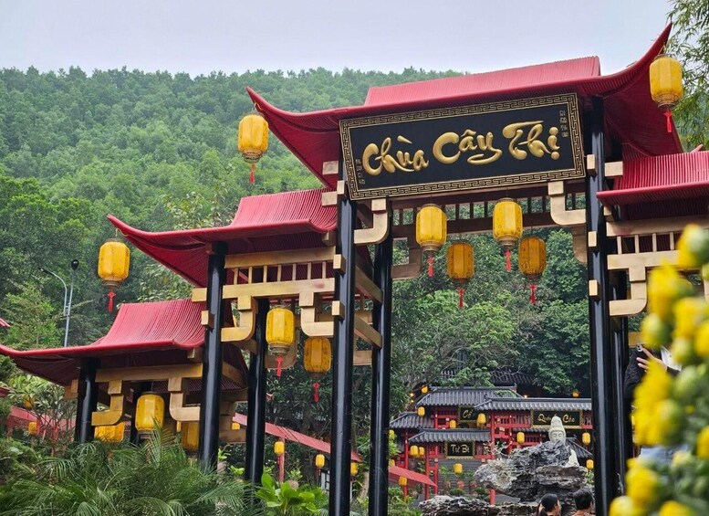 Traditional Chinese architecture with red and yellow elements, including lanterns and a sign with Chinese characters. 2