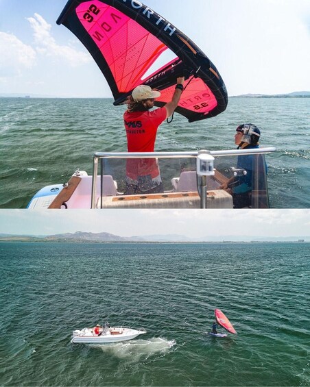 A person on a boat with a kiteboard, another on a smaller boat, and a distant shoreline. 2