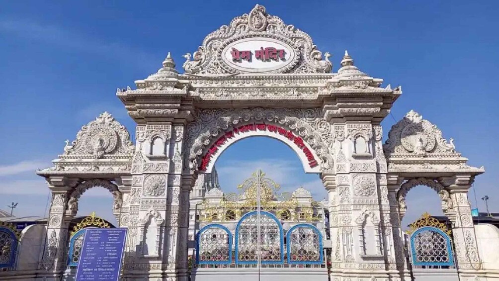 An ornate temple entrance with intricate carvings and a central archway. 4
