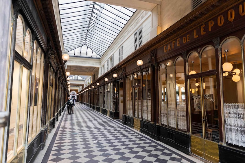 A checkered floor, a glass ceiling, and a cafe named 'Cafe de L'Epoque.' 5