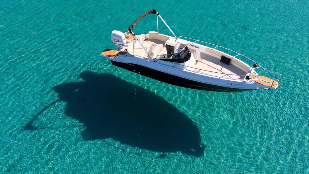 A boat on clear turquoise water. 3