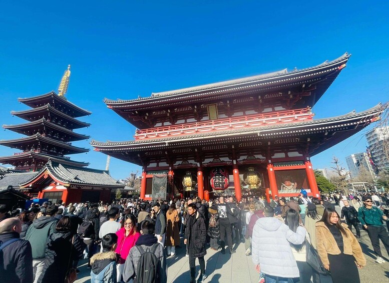 A traditional Japanese temple with multiple pagoda-style towers and a large red building with a golden roof. 3