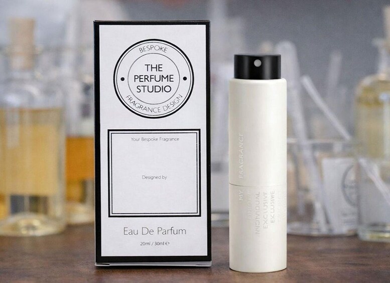 A perfume box and bottle labeled 'The Perfume Studio' with 'Eau De Parfum' and '20ml / 30ml e' on the box. 4