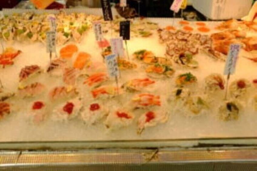 A seafood display with various types of fish and seafood arranged on ice. 4