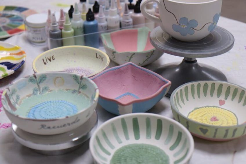 A collection of colorful ceramic bowls with various patterns and designs. 5