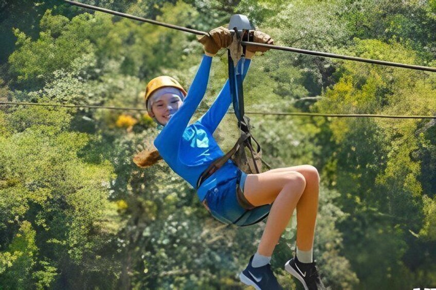 A person zip-lining through a forest. 3