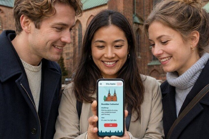 Three people looking at a smartphone displaying a cathedral. 4