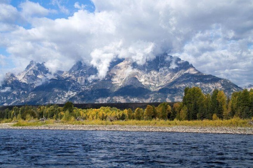 A river with mountains in the background. 2