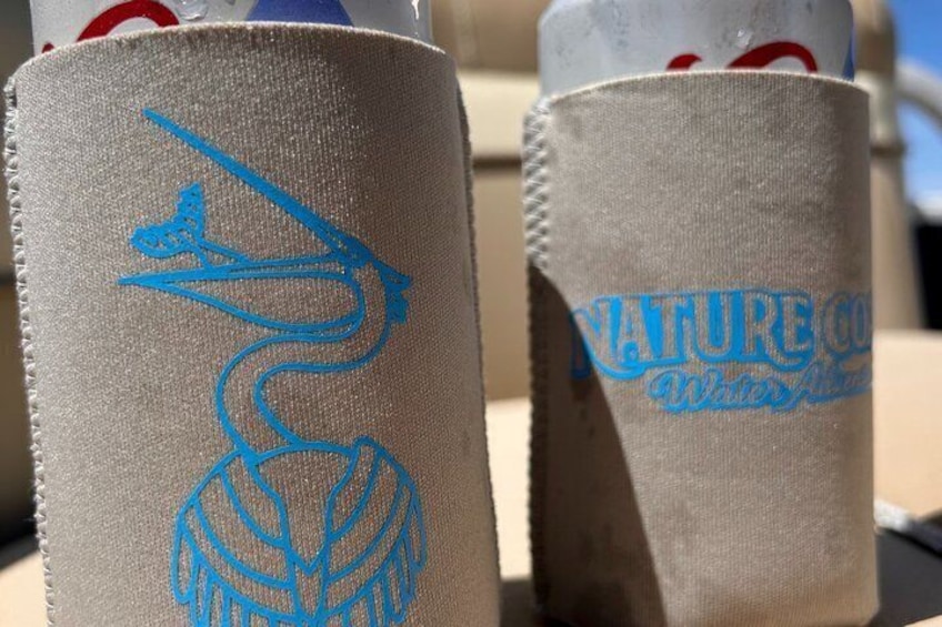 Two cylindrical objects with blue embroidery and text. 2