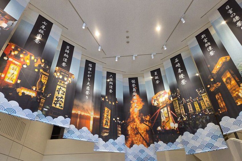 A room with banners displaying Japanese text and traditional lanterns. 4