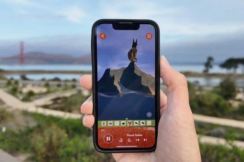 Un teléfono inteligente muestra un juego con una montaña y un puente al fondo. 1