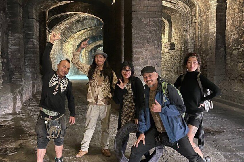 A group of people in an ancient stone archway. 4