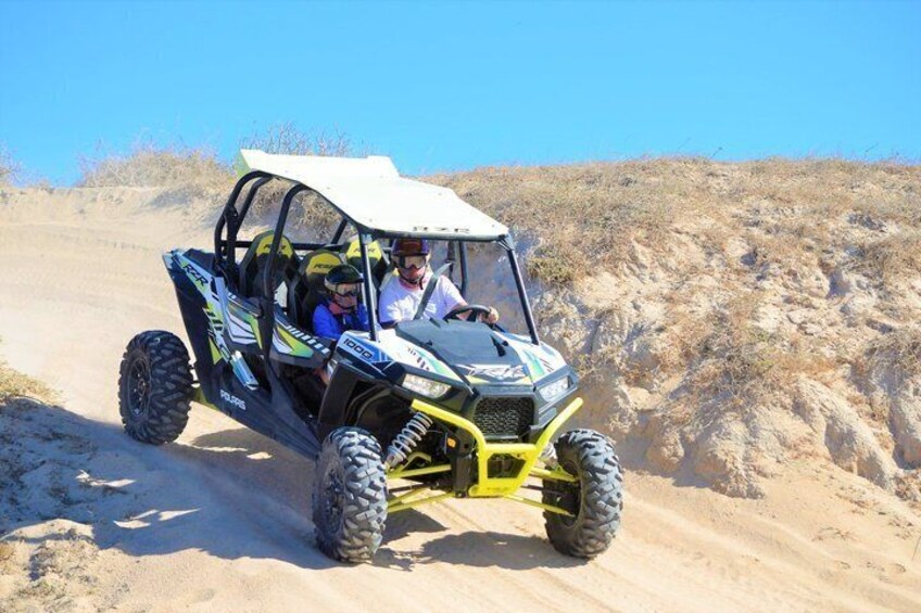 A dune buggy on a sandy trail. 4