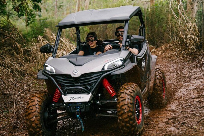 A ZORATZ off-road vehicle on a muddy trail. 1