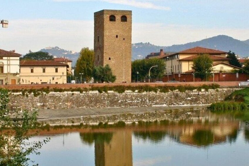 A tower, a river, and buildings in a town. 4