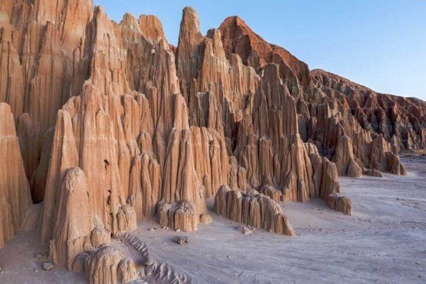 A series of tall, narrow rock formations with a flat base, likely a geological feature. 4