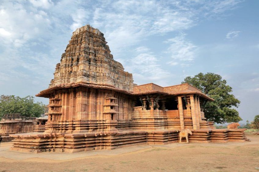 A large, ancient temple with a tiered tower and detailed carvings. 2