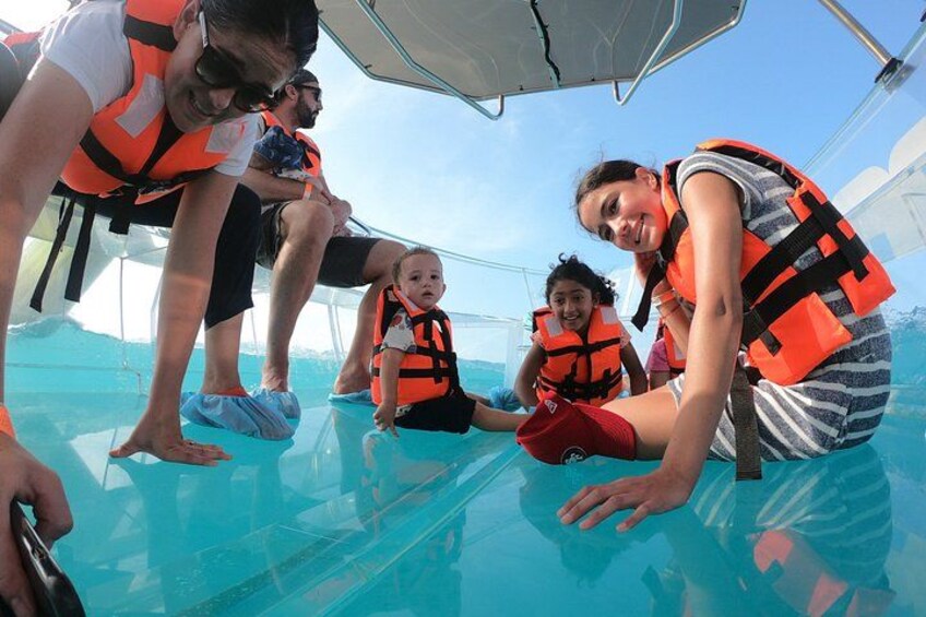 People wearing life jackets on a boat. 2