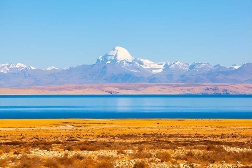 A vast salt flat with a mountain range in the background. 5