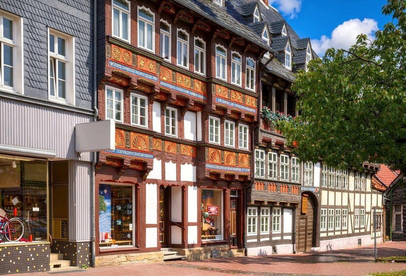 A traditional European building with ornate facades and a bicycle parked outside. 3