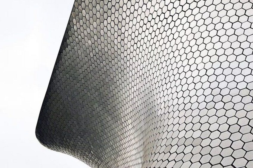A close-up of a hexagonal patterned material. 4