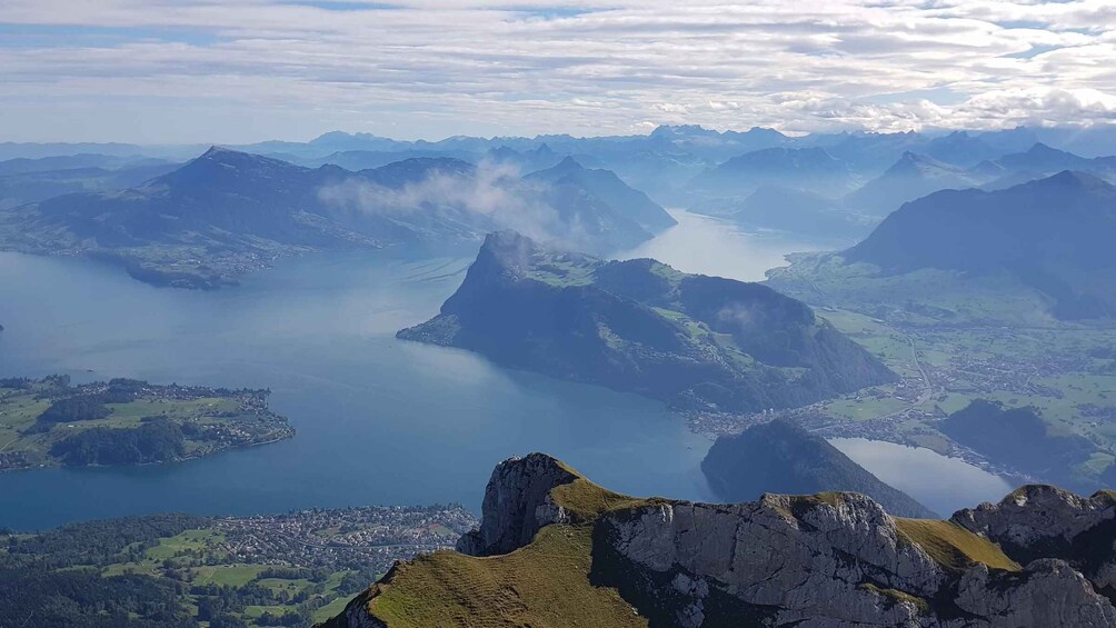 A mountainous landscape with a valley and a lake. 5