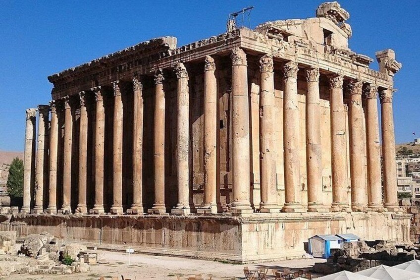 An ancient Greek temple with tall columns and a pediment. 1