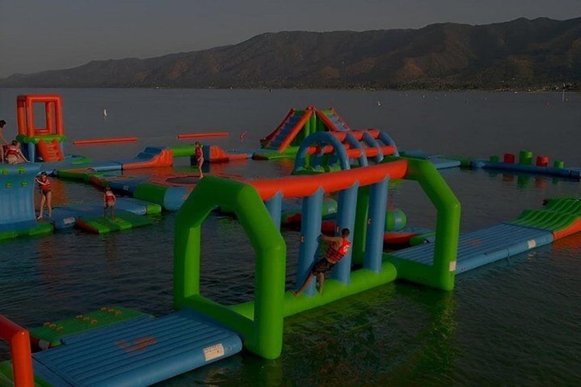 An inflatable water park with slides and play structures. 2