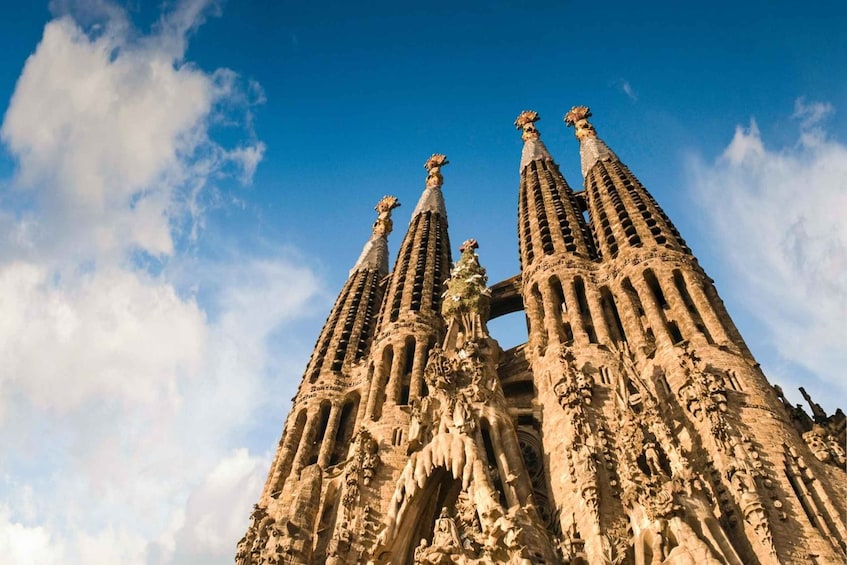 The Sagrada Familia's intricate facade with multiple spires and detailed sculptures. 1