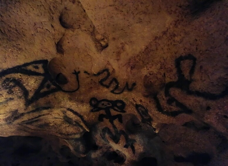 Ancient cave wall with petroglyphs. 5