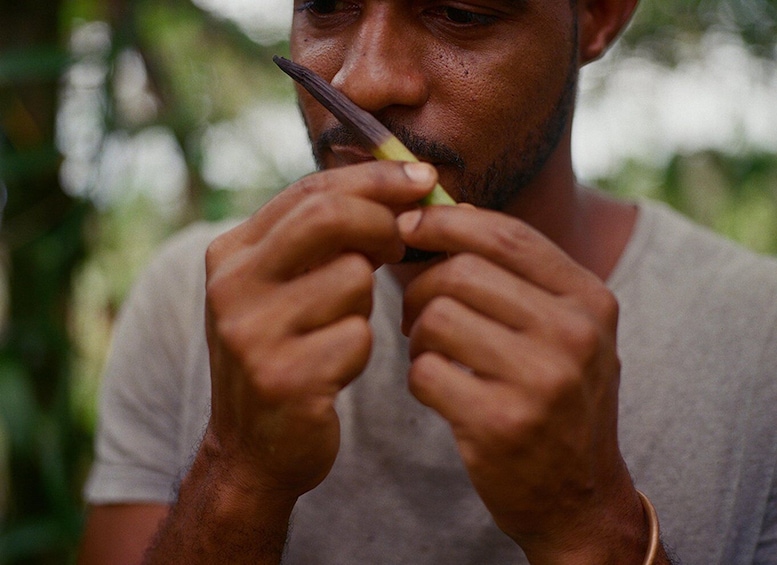 A person holding a green object. 3