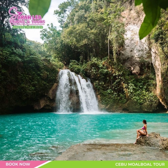 A waterfall in a lush, green landscape with clear turquoise water. 3