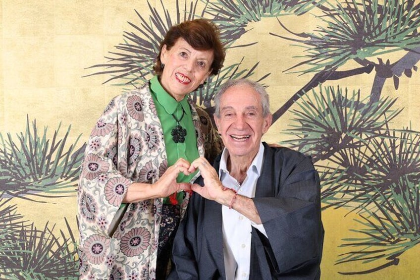 Two people making a heart shape with their hands. 5
