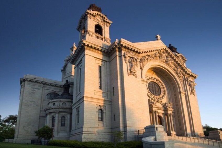 A large, ornate church with a prominent bell tower and a large arched entrance. 2