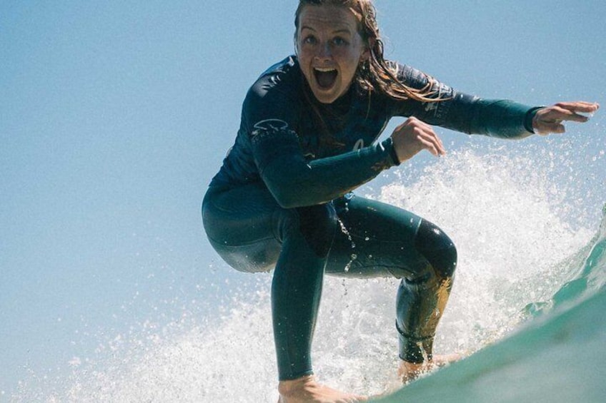 A person surfing on a wave. 1