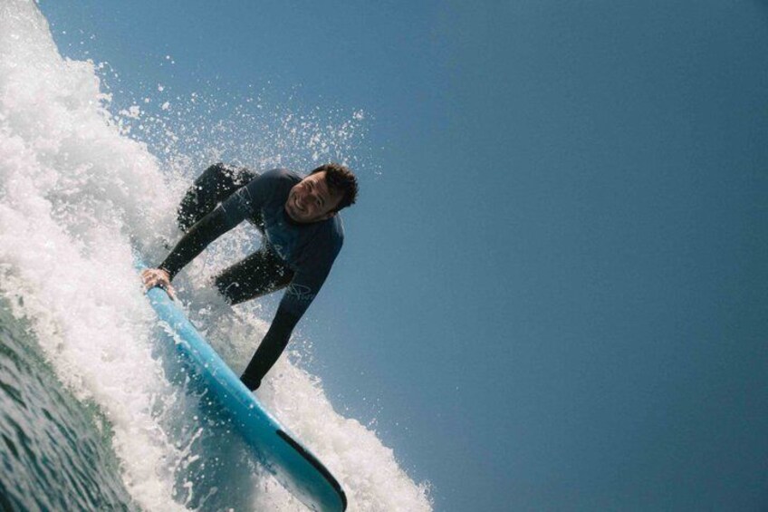 A person surfing on a wave. 3