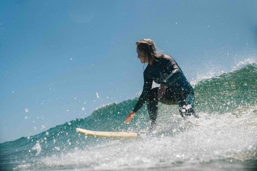 A person surfing on a wave. 5