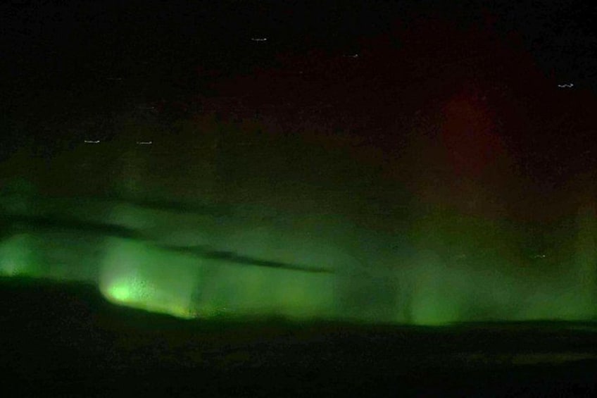 A dark scene with green lights. 1