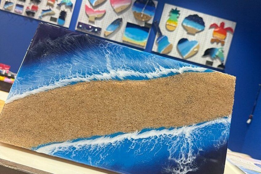 A painting of a beach scene with waves and sand. 3