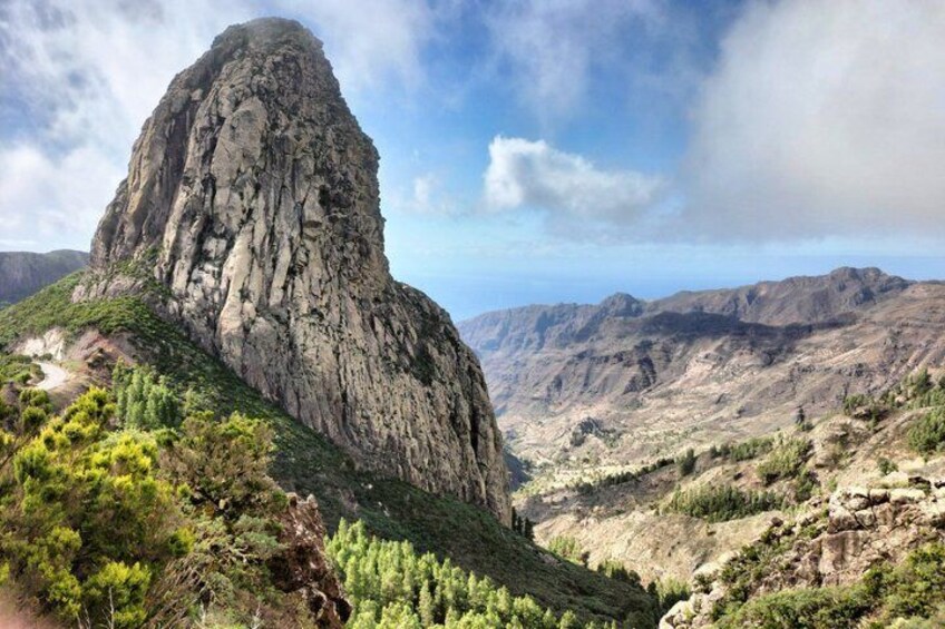 A rugged mountain peak with a valley below. 3